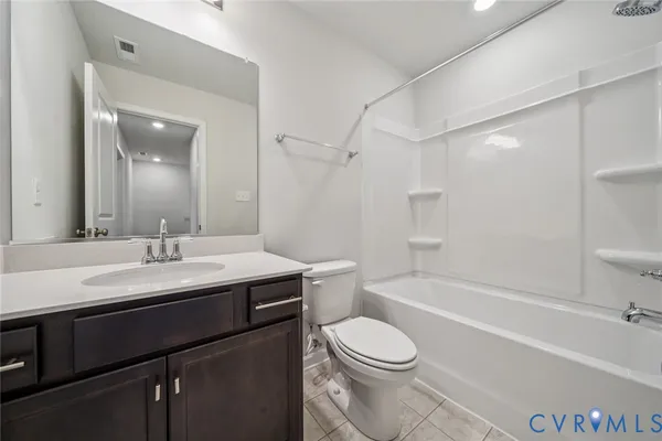 a bathroom with a sink a toilet and a bathtub