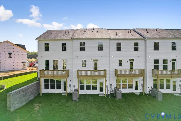 front view of a house with a yard table and chairs
