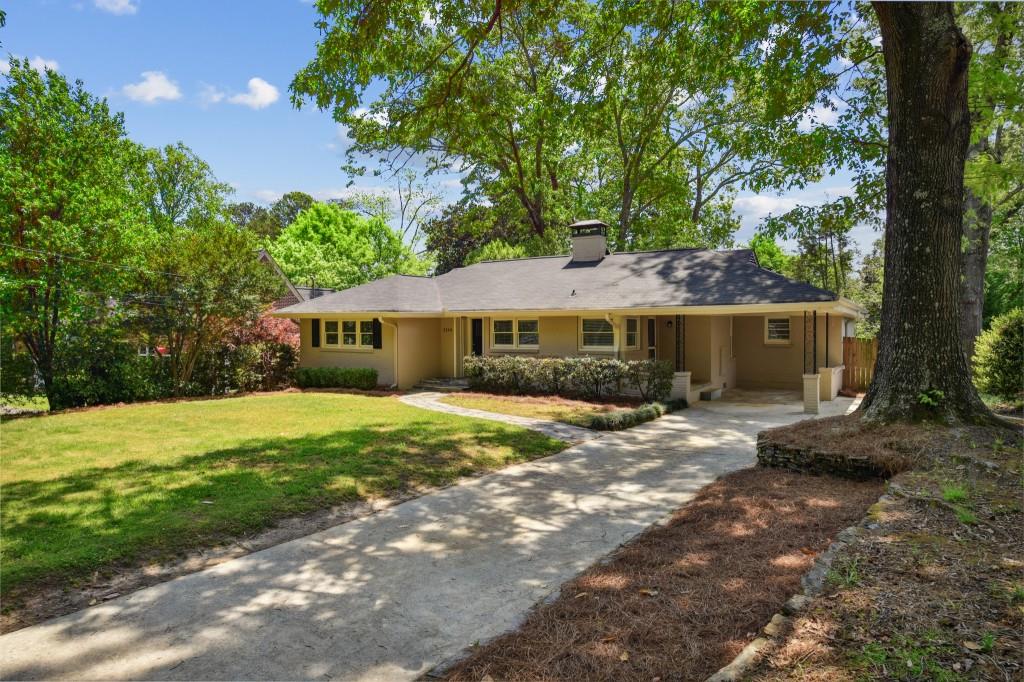 3549 Kingsboro Road Northeast Atlanta, GA 30319 - Photo 1 of 1 a front view of a house with a garden