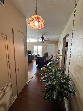 a view of a livingroom with furniture and chandelier