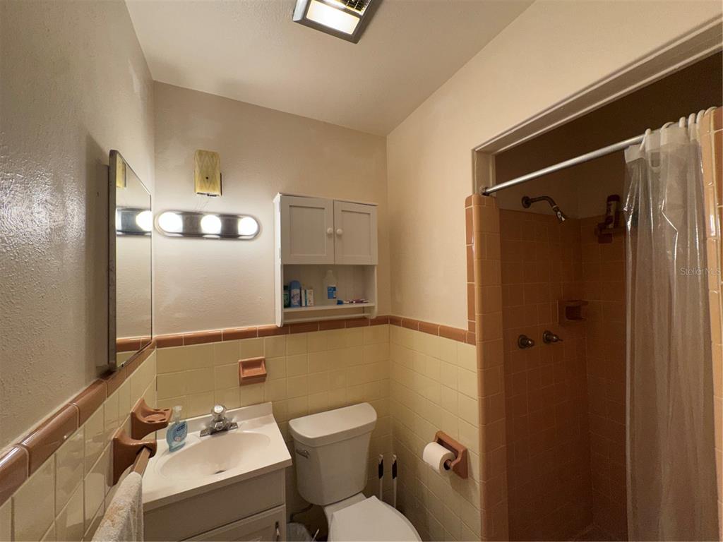 2263 North Lake Reedy Boulevard Frostproof, FL 33843 - Photo 20 of 50 a bathroom with a sink mirror vanity and toilet