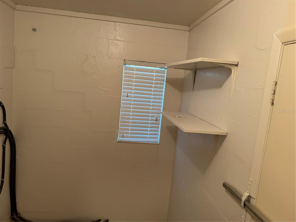 2263 North Lake Reedy Boulevard Frostproof, FL 33843 - Photo 23 of 50 a bathroom with a shower and a sink