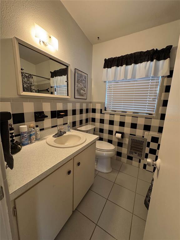 2263 North Lake Reedy Boulevard Frostproof, FL 33843 - Photo 24 of 49 a kitchen with a sink and cabinets