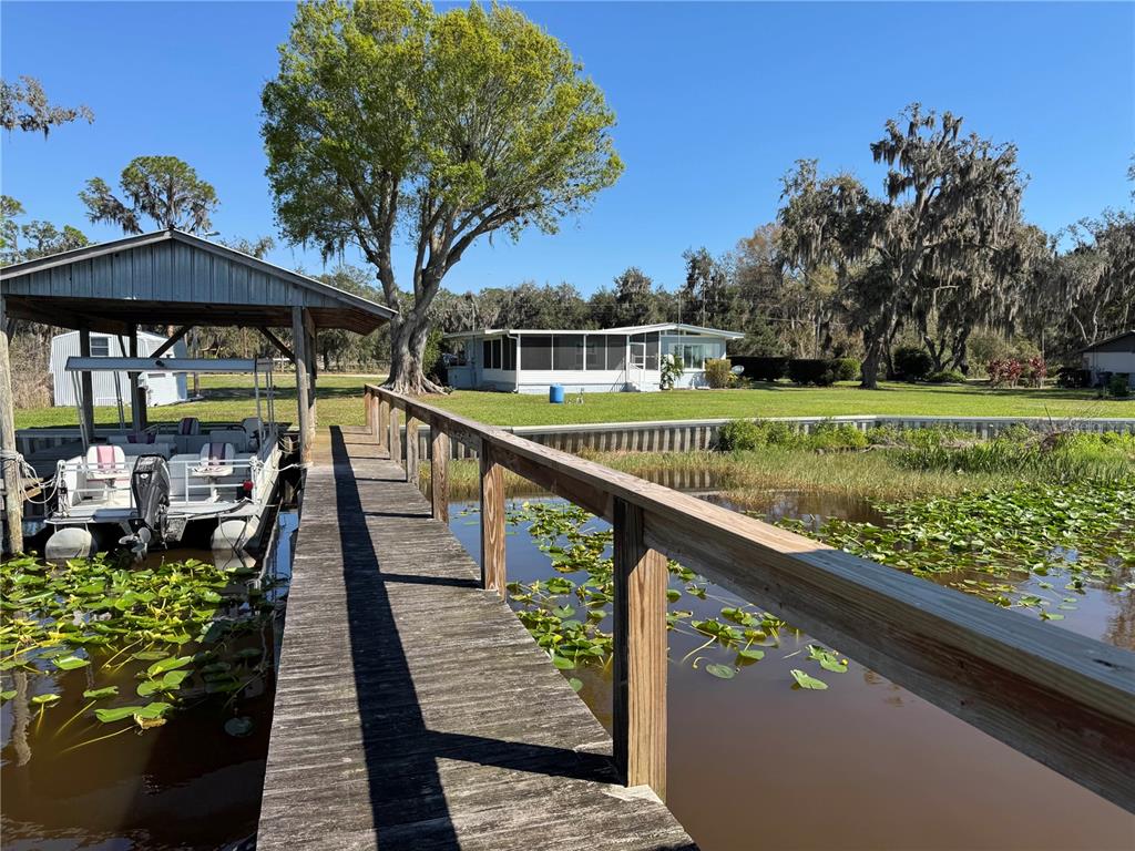 2263 North Lake Reedy Boulevard Frostproof, FL 33843 - Photo 3 of 49 a view of swimming pool from a balcony