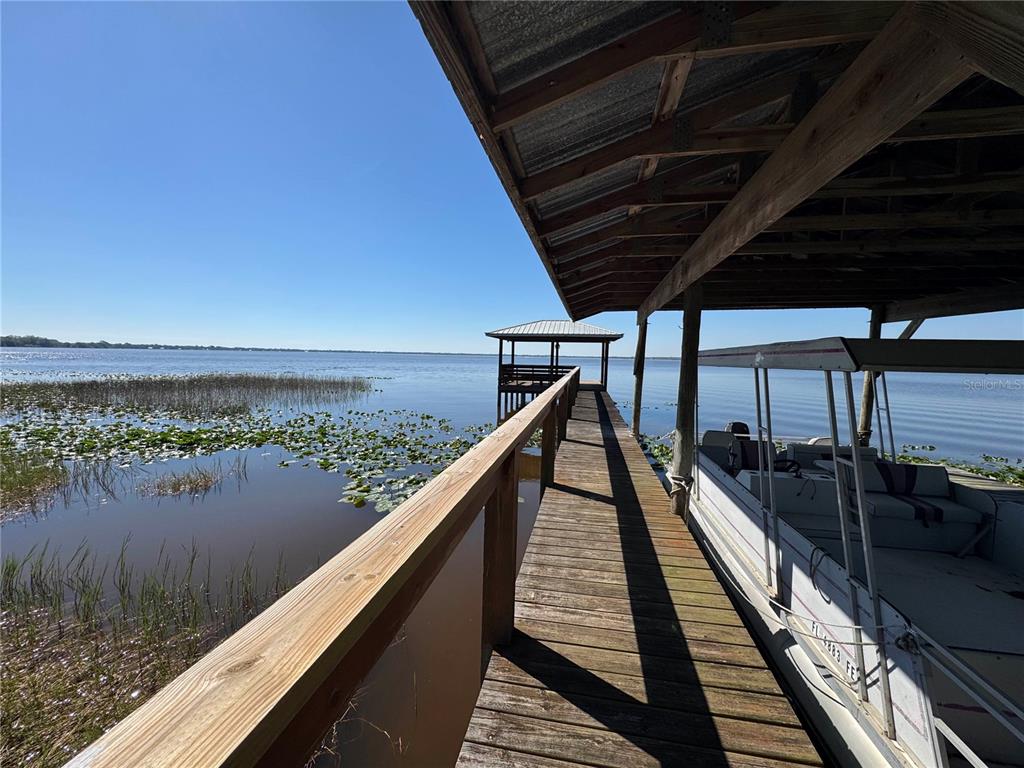 2263 North Lake Reedy Boulevard Frostproof, FL 33843 - Photo 35 of 49 a view of a balcony with wooden floor