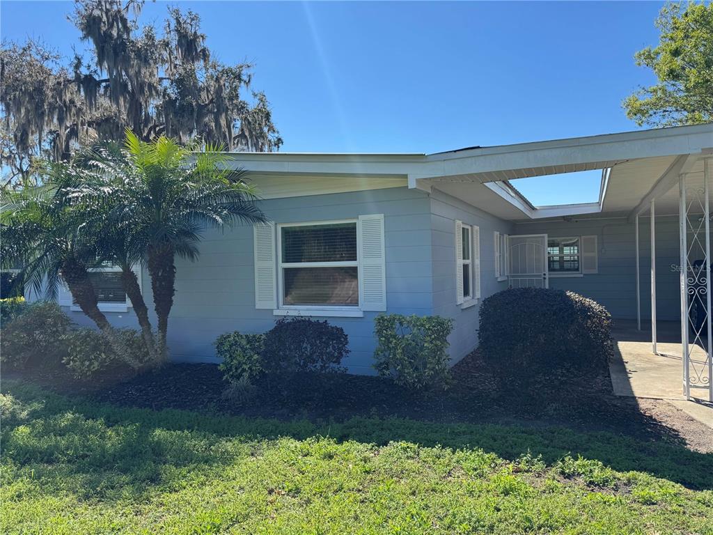 2263 North Lake Reedy Boulevard Frostproof, FL 33843 - Photo 38 of 50 a front view of a house with garden