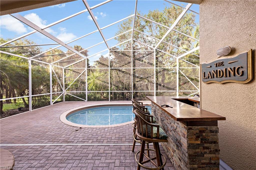 227 Glen Eagle Circle Naples, FL 34104 - Photo 24 of 25 a outdoor view with a sitting space