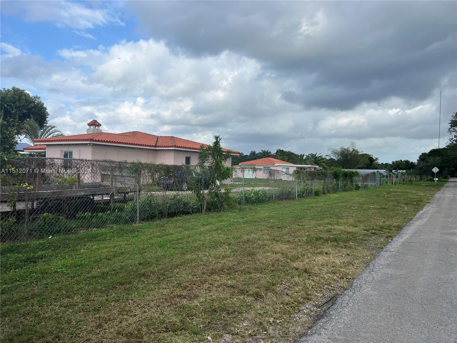 Redlands Homestead, FL 33031 - Photo 13 of 14 a view of a garden with a building in the background