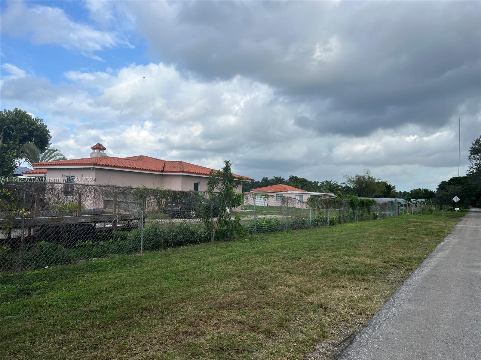 Redlands Homestead, FL 33031 - Photo 14 of 14 a view of a garden with a building in the background