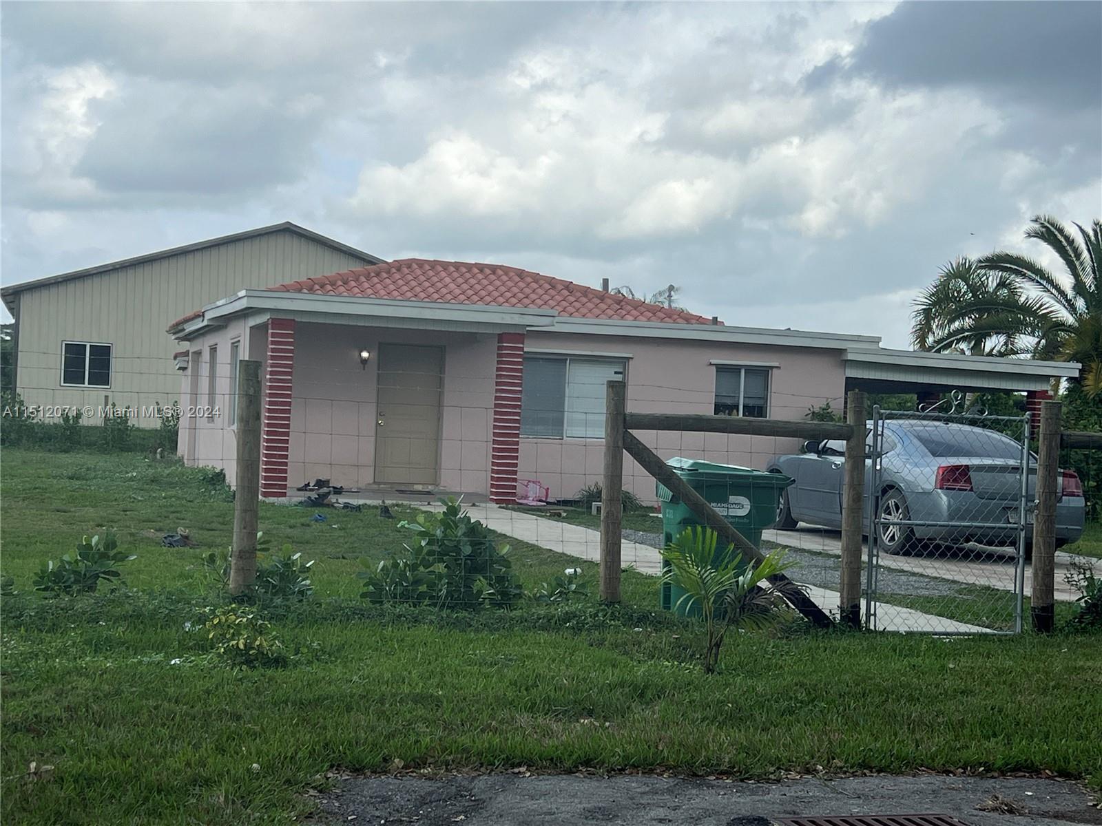 Redlands Homestead, FL 33031 - Photo 2 of 14 a view of backyard of house with green space