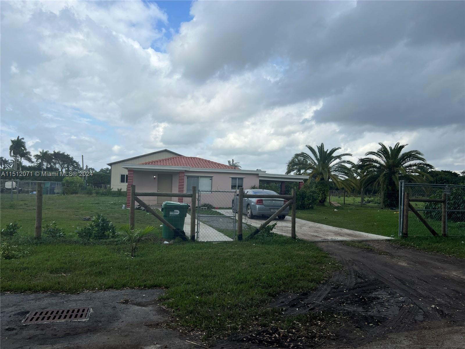 Redlands Homestead, FL 33031 - Photo 3 of 14 a view of a house with a yard and sitting area