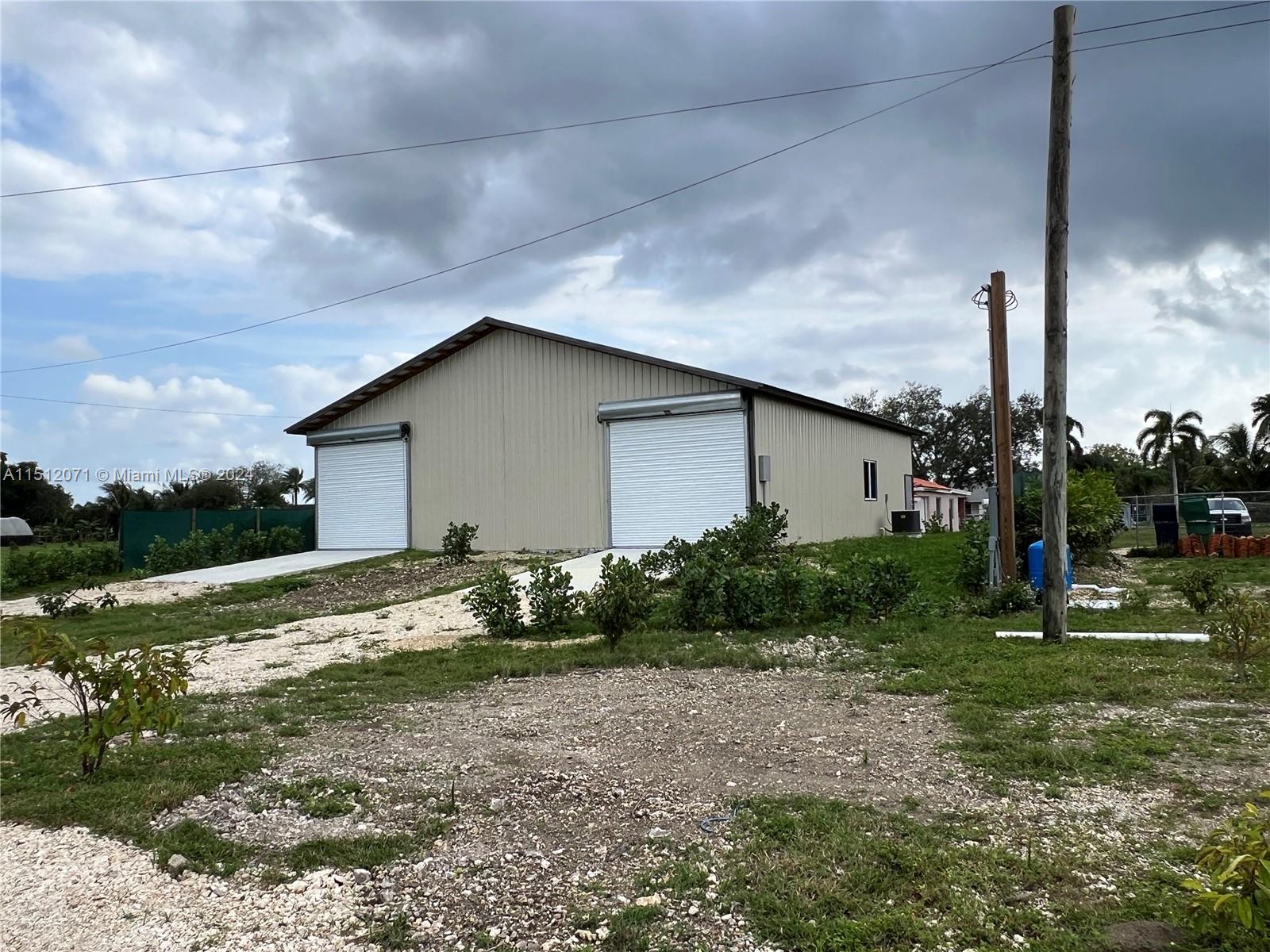 Redlands Homestead, FL 33031 - Photo 7 of 14 a view of a house with backyard and trees