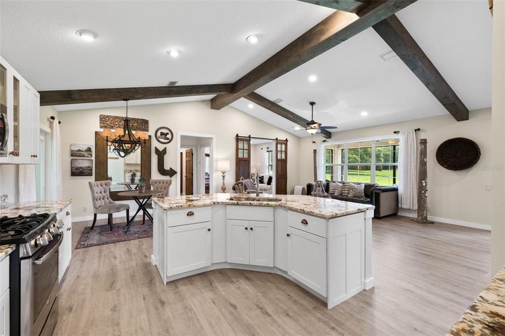 14765 Highway 41 Spring Hill, FL 34610 - Photo 12 of 61 a large white kitchen with a large window