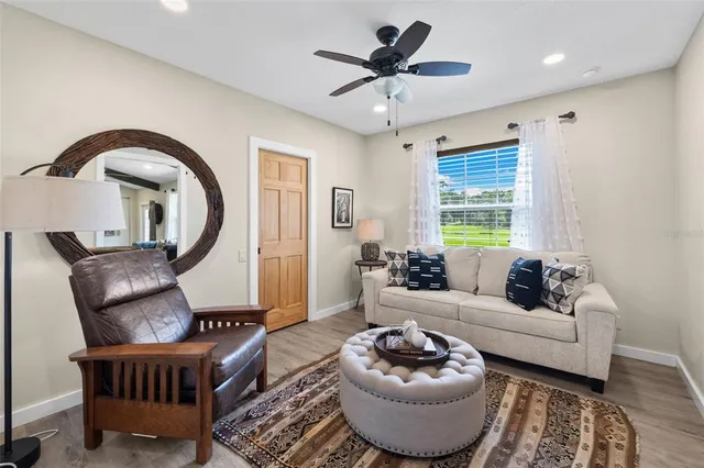 a bathroom with a sink a toilet and shower curtain