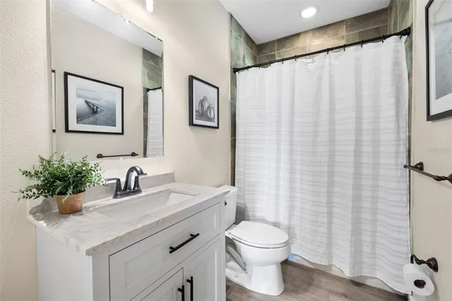 a bedroom with a bed and a table