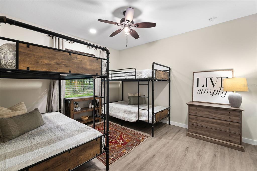 14765 Highway 41 Spring Hill, FL 34610 - Photo 17 of 61 a bedroom with a bed and a table