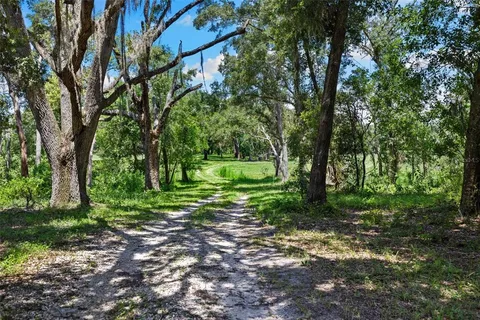 a view of a lake with a big yard