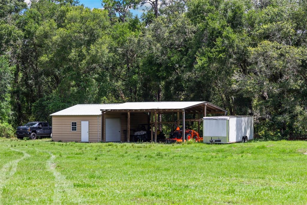 14765 Highway 41 Spring Hill, FL 34610 - Photo 57 of 61 a view of a house with backyard and trees
