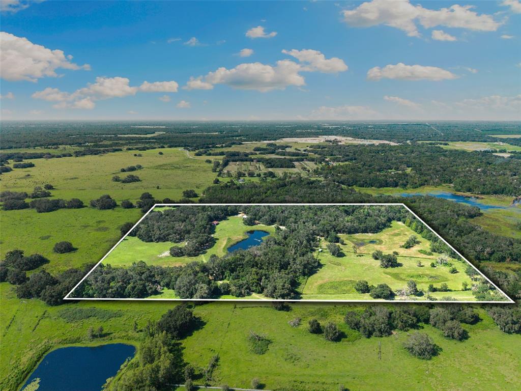 14765 Highway 41 Spring Hill, FL 34610 - Photo 59 of 61 an aerial view of lake residential house with outdoor space