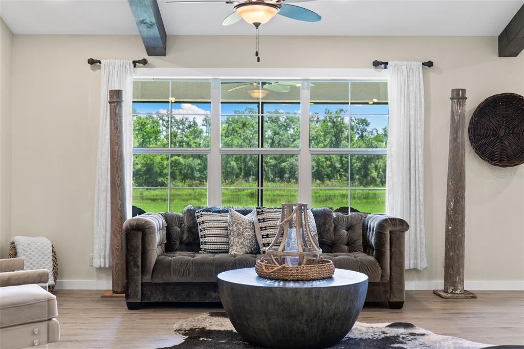 14765 Highway 41 Spring Hill, FL 34610 - Photo 7 of 61 a living room with furniture and a window