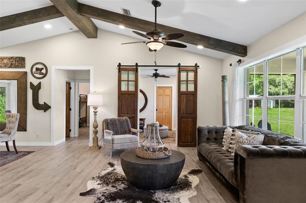14765 Highway 41 Spring Hill, FL 34610 - Photo 9 of 61 a living room with furniture and a large window