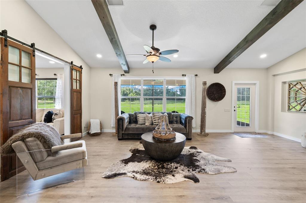 14765 Highway 41 Spring Hill, FL 34610 - Photo 10 of 61 a living room with furniture and a large window