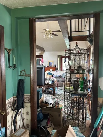 a room with lots of wooden furniture and a chandelier
