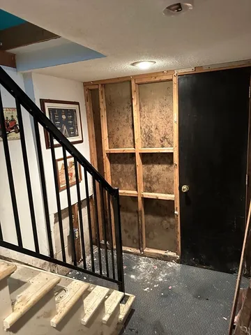 a view of staircase with window