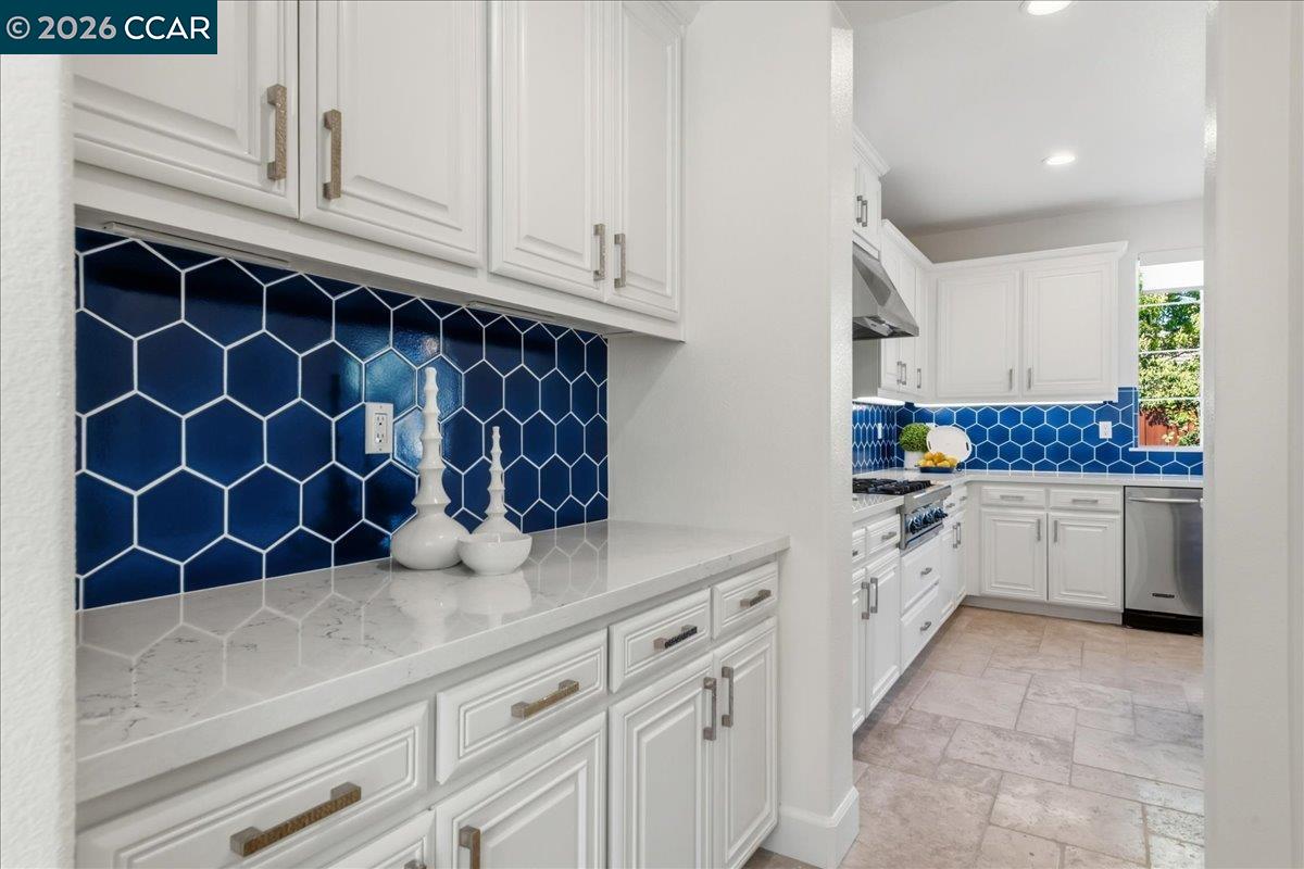 211 Cullens Court San Ramon, CA 94582 - Photo 12 of 56 a kitchen with white cabinets and white appliances