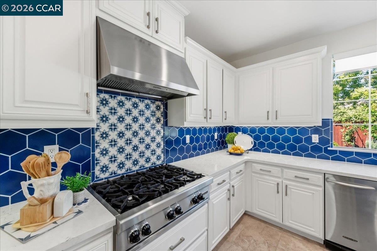 211 Cullens Court San Ramon, CA 94582 - Photo 15 of 56 a kitchen with stainless steel appliances a stove a sink and cabinets