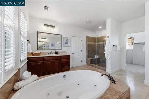 a bedroom with a bed and a cabinets
