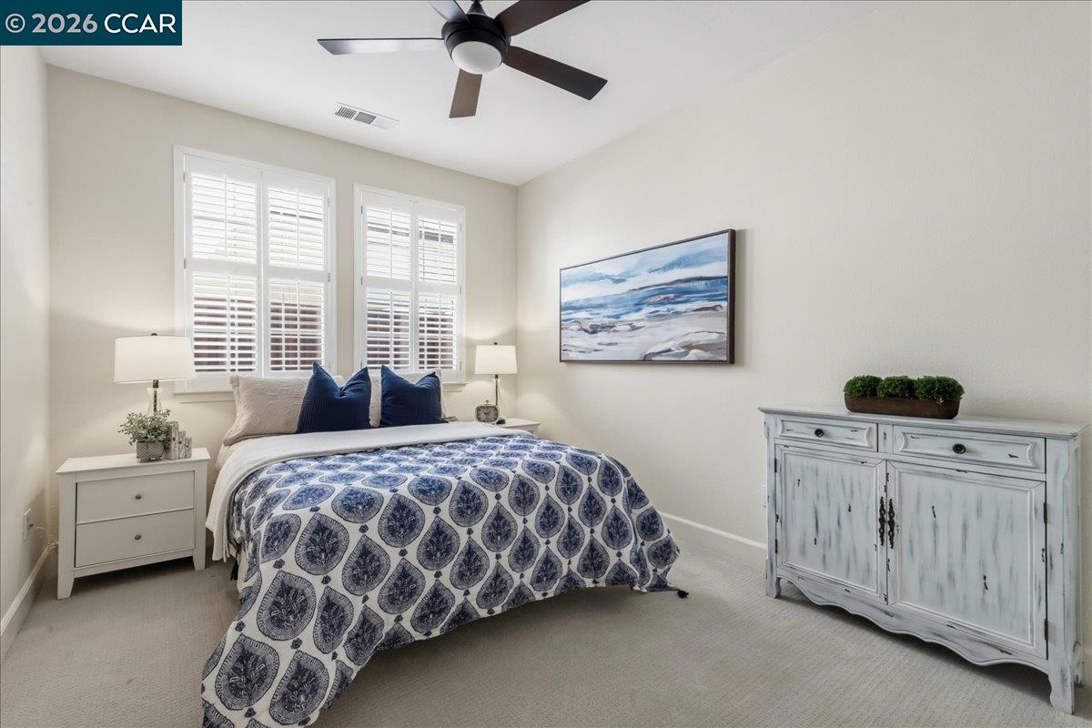 211 Cullens Court San Ramon, CA 94582 - Photo 29 of 56 a bedroom with a bed and a cabinets