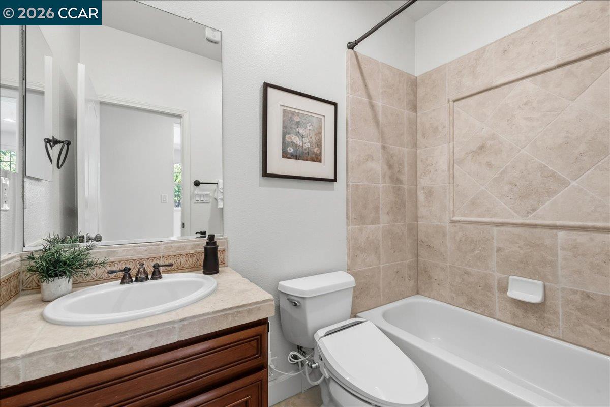 211 Cullens Court San Ramon, CA 94582 - Photo 30 of 56 a bathroom with a sink and a mirror