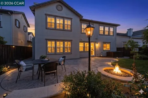 a swimming pool view with a outdoor seating