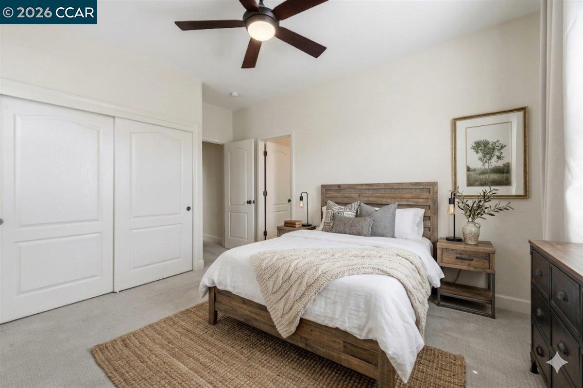 211 Cullens Court San Ramon, CA 94582 - Photo 36 of 56 a bedroom with a bed and a chandelier