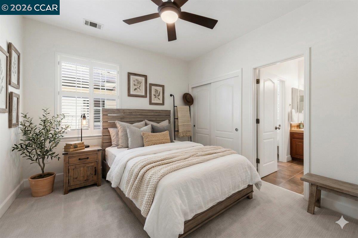 211 Cullens Court San Ramon, CA 94582 - Photo 38 of 56 a bedroom with a bed and a chandelier