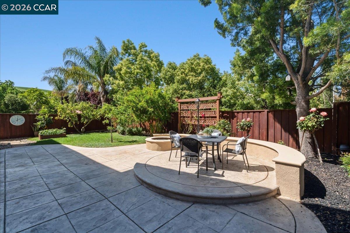 211 Cullens Court San Ramon, CA 94582 - Photo 43 of 56 a view of a patio with table and chairs potted plants and a palm tree