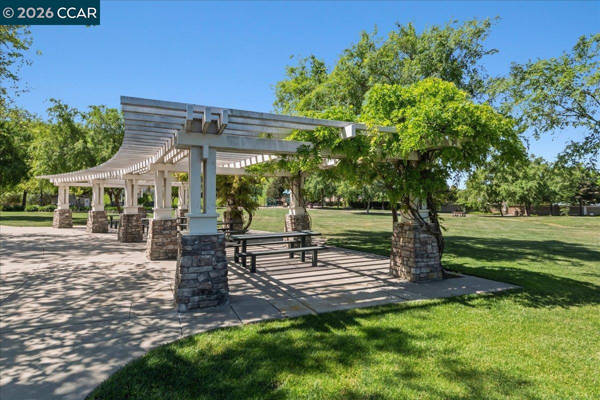 211 Cullens Court San Ramon, CA 94582 - Photo 46 of 56 a view of a patio with a table chairs and a yard