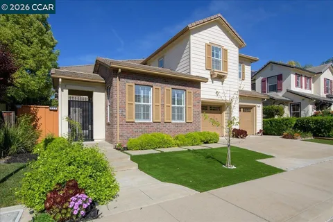 a view of a house with potted plants