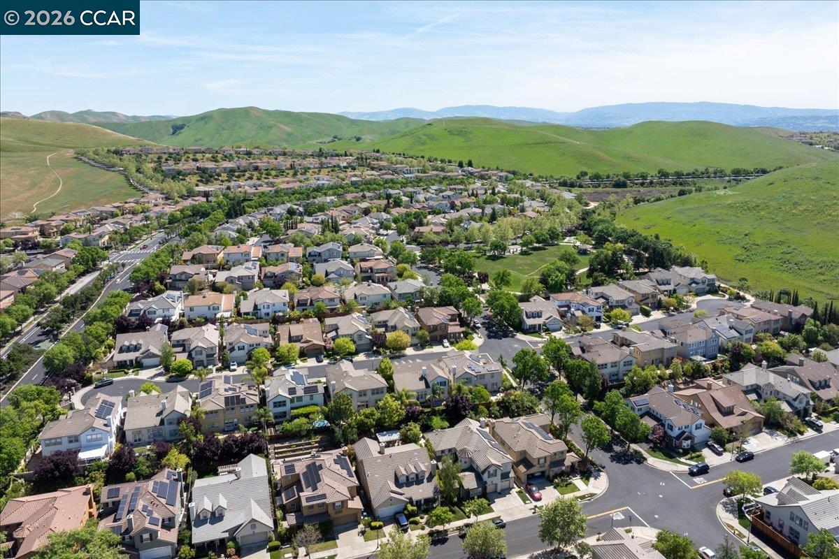 211 Cullens Court San Ramon, CA 94582 - Photo 51 of 56 an aerial view of a city with lots of residential buildings and mountain view in back