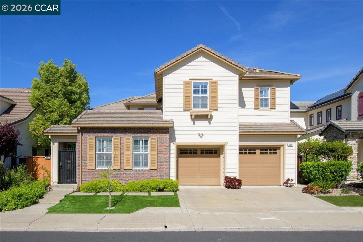 211 Cullens Court San Ramon, CA 94582 - Photo 55 of 56 a front view of a house with a yard and garage