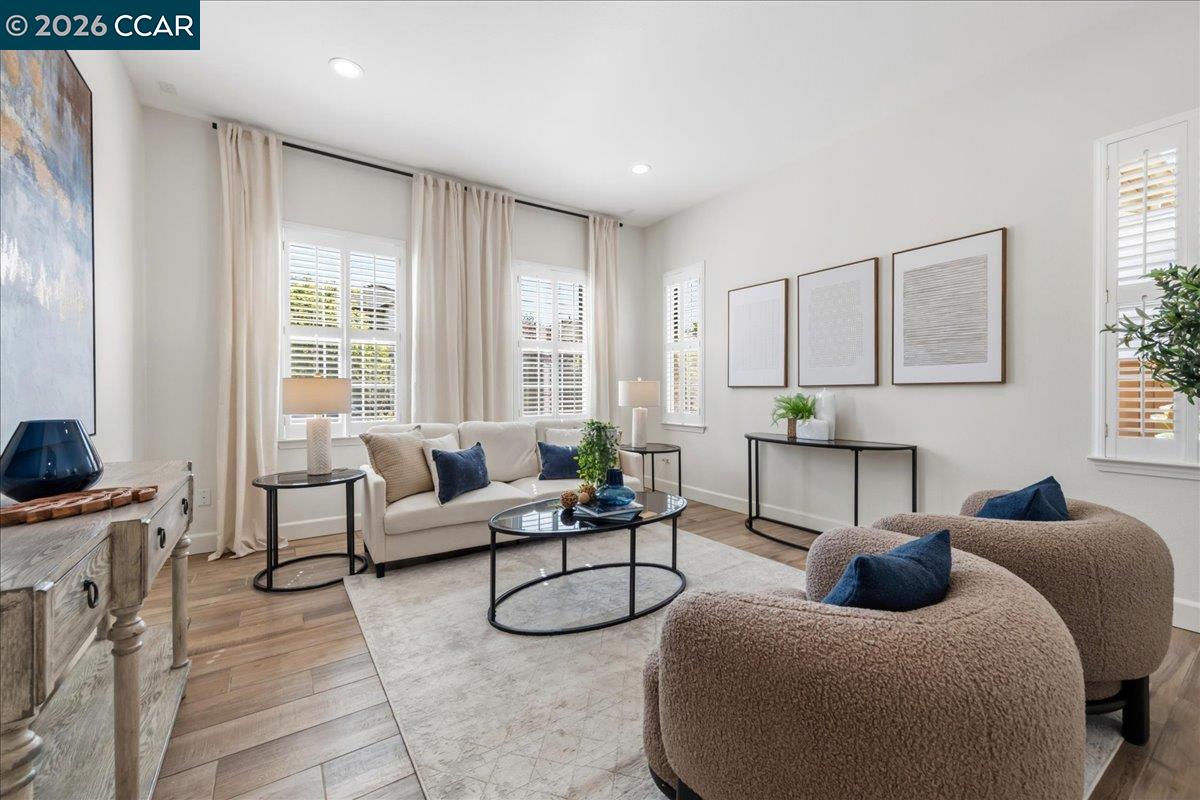 211 Cullens Court San Ramon, CA 94582 - Photo 9 of 56 a living room with furniture a fireplace and potted plants