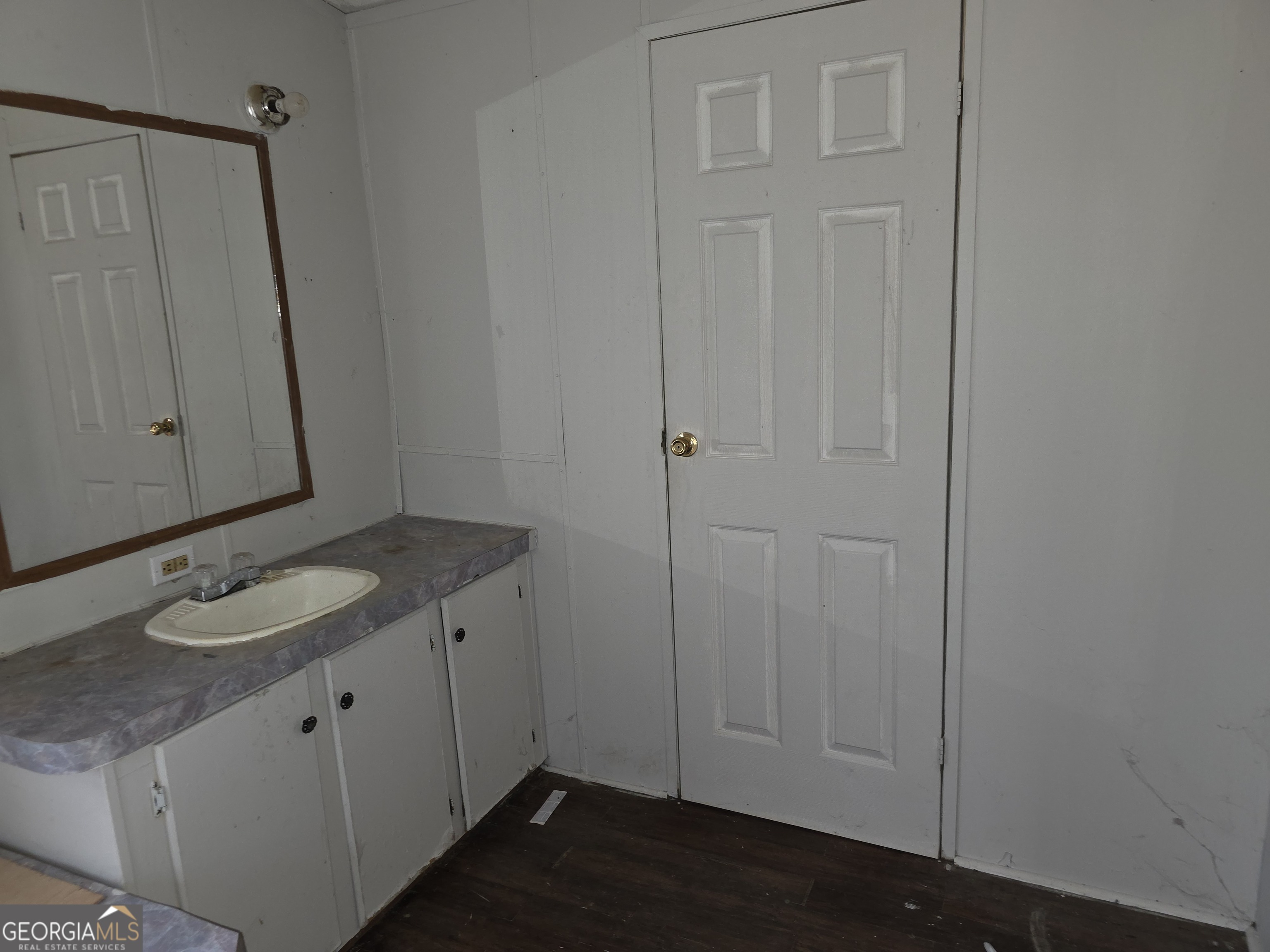 650 Wildcat Road Buchanan, GA 30113 - Photo 11 of 26 a bathroom with a granite countertop sink and mirror