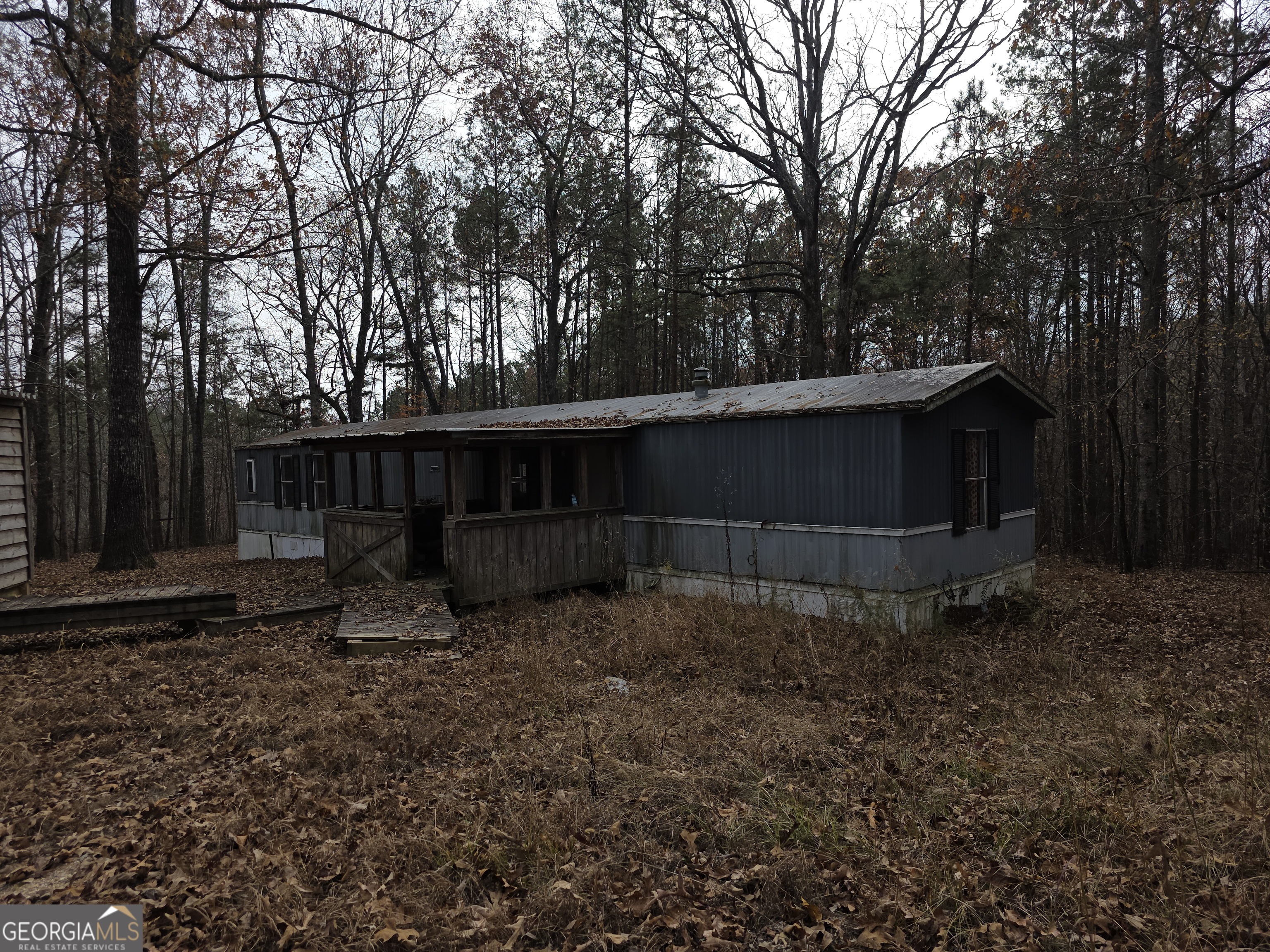 650 Wildcat Road Buchanan, GA 30113 - Photo 22 of 26 a view of a barn in the middle of a yard