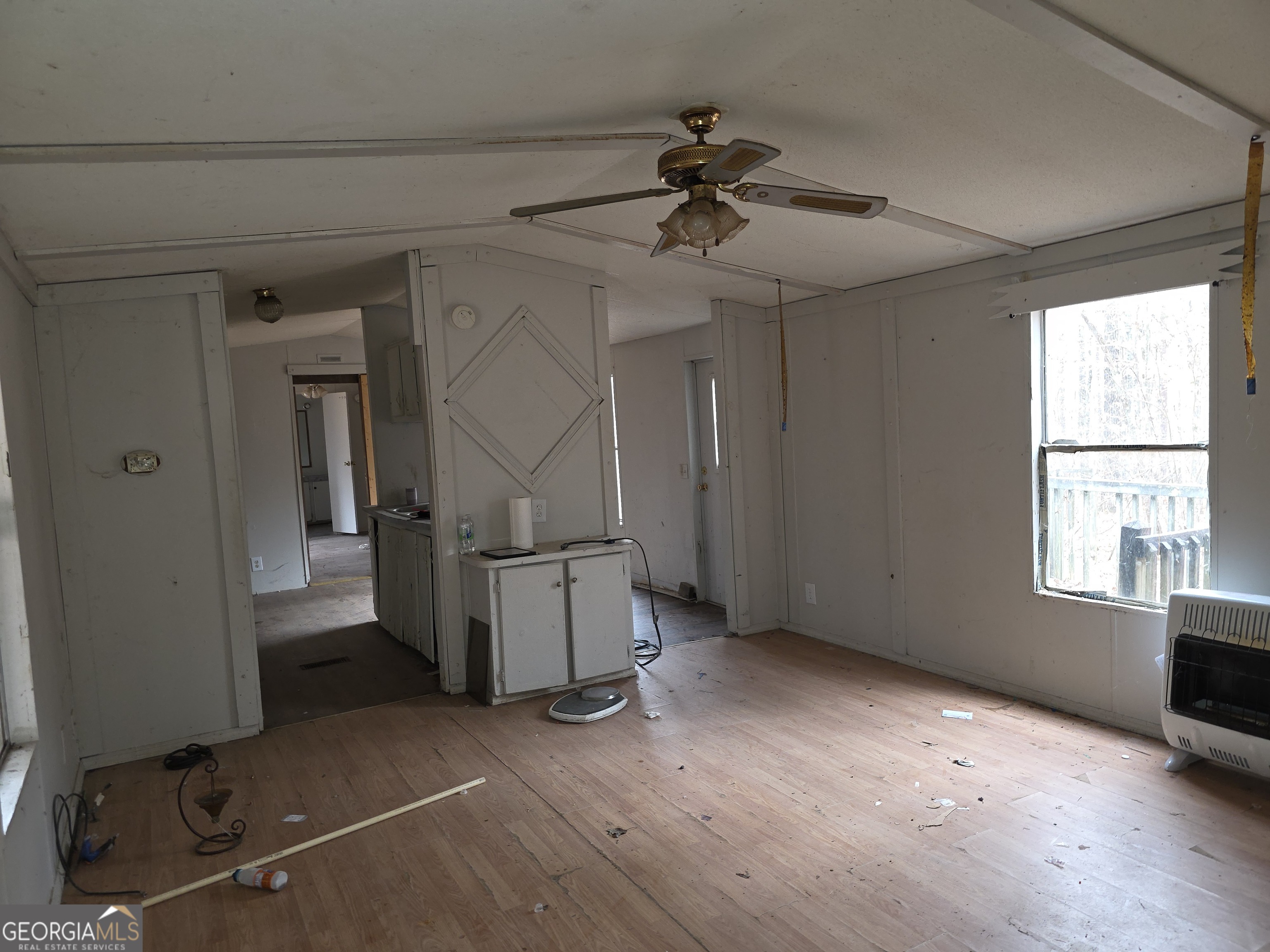 650 Wildcat Road Buchanan, GA 30113 - Photo 3 of 26 a view of empty room with windows and ceiling fan