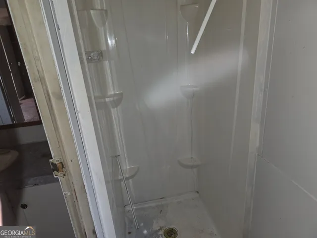 a bathroom with a granite countertop sink and mirror
