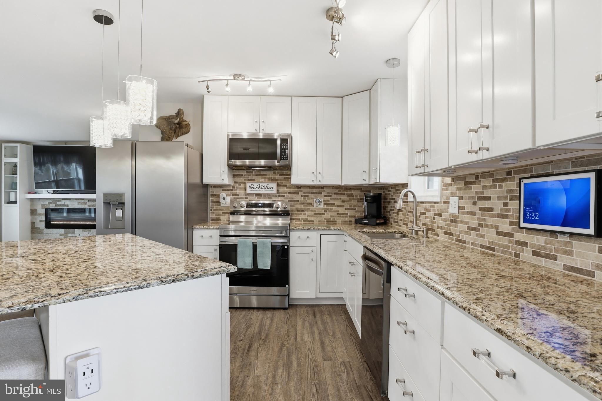 1025 White Oak Road Windsor, PA 17366 - Photo 11 of 70 a kitchen with stainless steel appliances granite countertop a sink stove and refrigerator