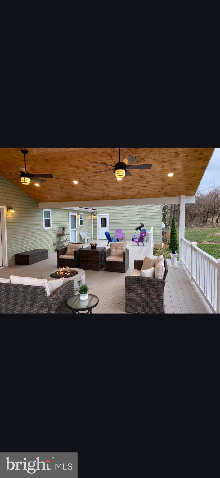 1025 White Oak Road Windsor, PA 17366 - Photo 61 of 70 a view of a patio with table and chairs with wooden floor