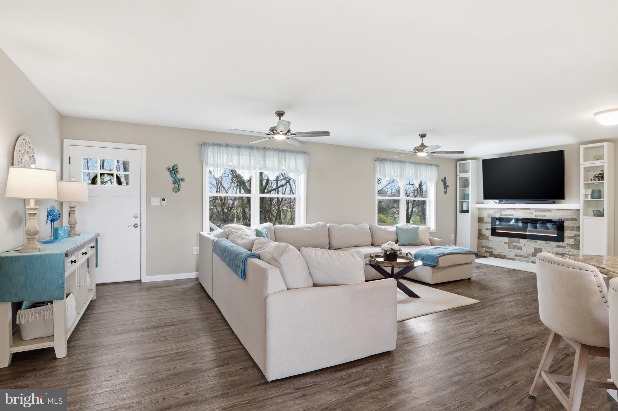 1025 White Oak Road Windsor, PA 17366 - Photo 6 of 70 a living room with fireplace furniture and a flat screen tv