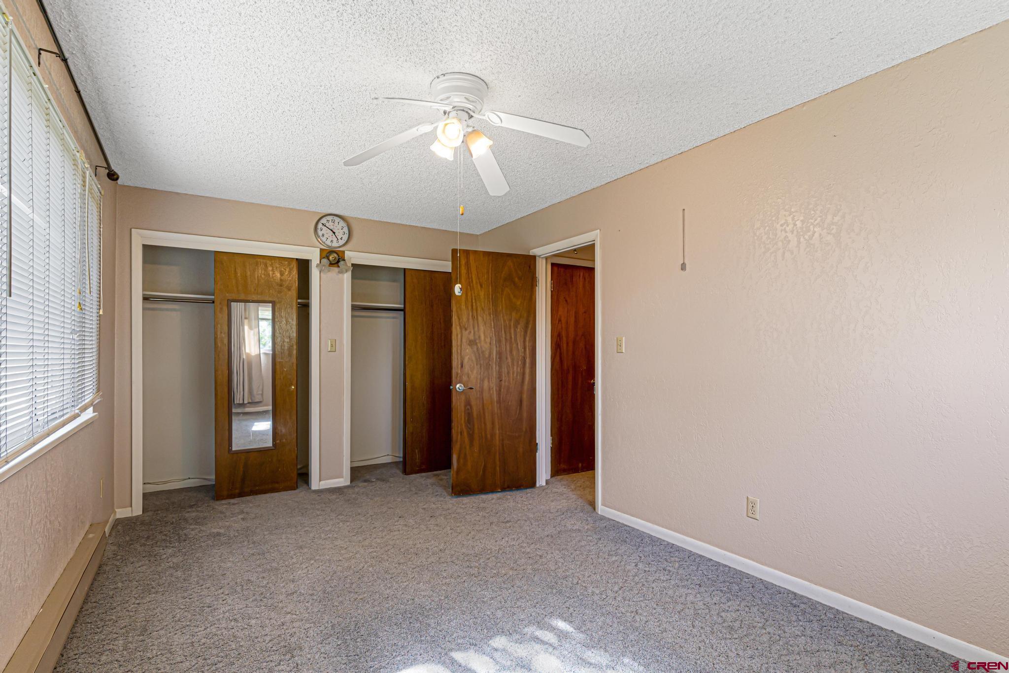 60918 Gunnison Road Montrose, CO 81401 - Photo 29 of 37 an empty room with chandelier fan